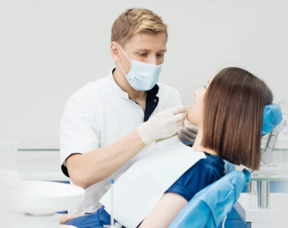 Girl with the dentist undergoing oral surgery in Markham, ON.