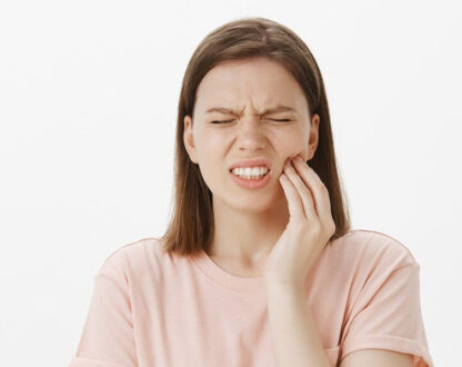 Girl suffering from teeth sensitivity.