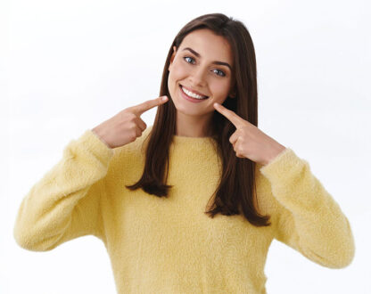 Girl showing her beautiful smile after getting dental fillings in Markham, ON.